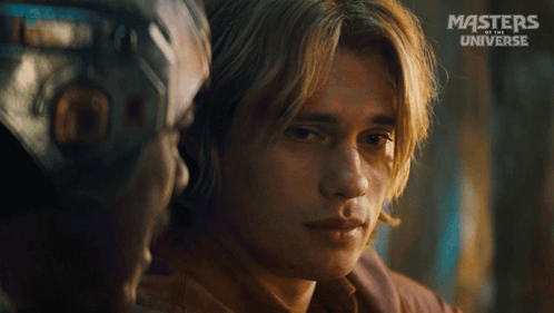 A Close Up Of A Man 'S Face With The Words Masters Of The Universe On The Bottom Right GIF