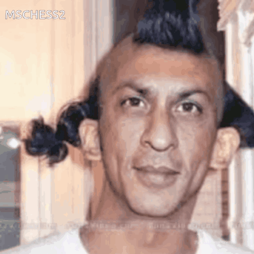 A Close Up Of A Man 'S Face With The Words Mschess2 On The Bottom Right GIF