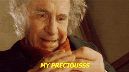 A Close Up Of A Man 'S Face With The Words `` My Preciousss '' Written On The Bottom . GIF