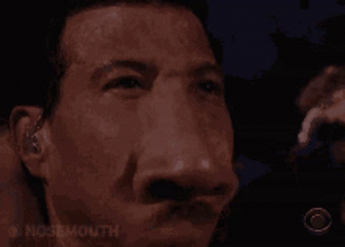 A Close Up Of A Man 'S Face With The Words Nosemouth Written On The Bottom GIF