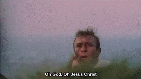 A Close Up Of A Man 'S Face With The Words `` Oh God , Oh Jesus Christ '' Written Above Him . GIF