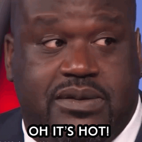 A Close Up Of A Man 'S Face With The Words Oh It 'S Hot GIF