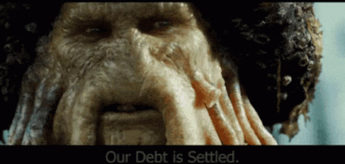 a close up of a man 's face with the words our debt is settled below it