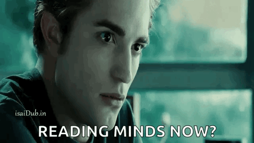 A Close Up Of A Man 'S Face With The Words Reading Minds Now Written On It . GIF