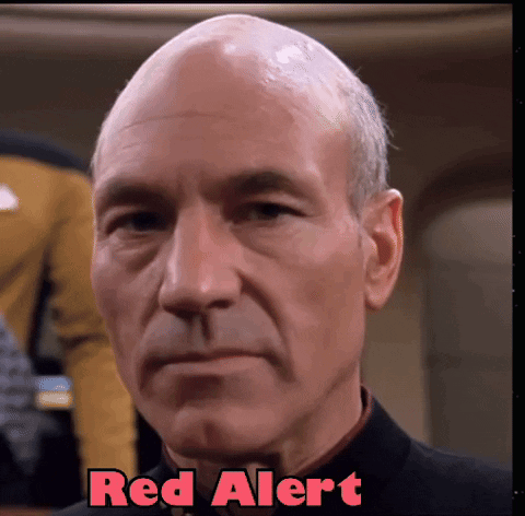 A Close Up Of A Man 'S Face With The Words Red Alert Written Above Him GIF