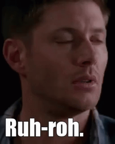 A Close Up Of A Man 'S Face With The Words `` Ruh-Roh '' On It . GIF