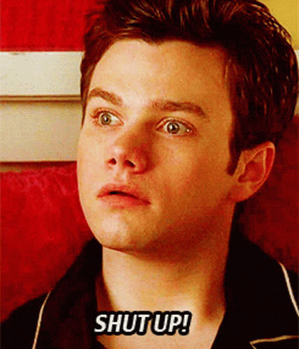 A Close Up Of A Man 'S Face With The Words Shut Up Written On It GIF