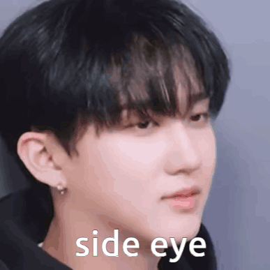 A Close Up Of A Man 'S Face With The Words `` Side Eye '' Written On It . GIF