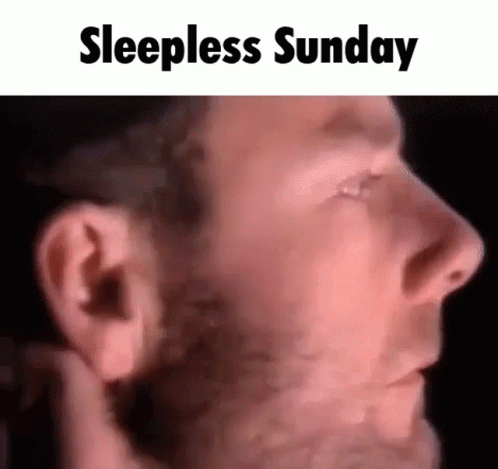 A Close Up Of A Man 'S Face With The Words `` Sleepless Sunday '' Written Above It . GIF