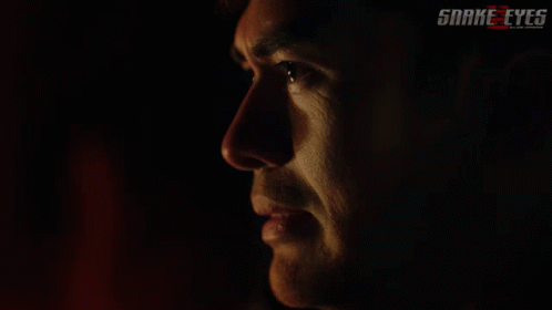 A Close Up Of A Man 'S Face With The Words Snake Eyes On The Bottom Right GIF