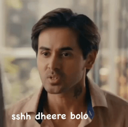 A Close Up Of A Man 'S Face With The Words Sshh Gheere Bolo Written On The Bottom GIF