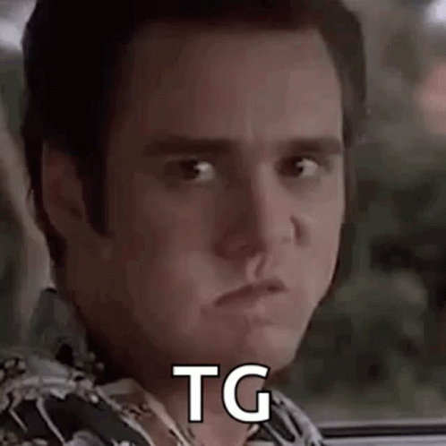 A Close Up Of A Man 'S Face With The Words `` Tg '' Written On His Face . GIF