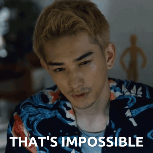 A Close Up Of A Man 'S Face With The Words That 'S Impossible Above Him GIF