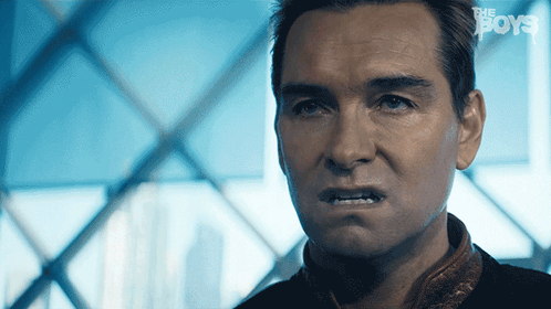A Close Up Of A Man 'S Face With The Words " The Boys " On The Bottom GIF