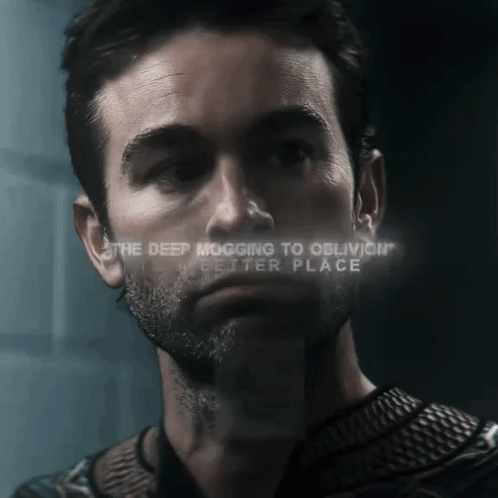 A Close Up Of A Man 'S Face With The Words " The Deep Mogging To Oblivion " Visible GIF