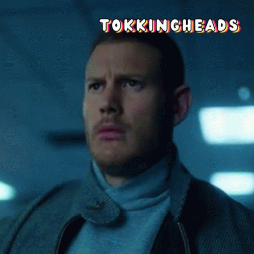 A Close Up Of A Man 'S Face With The Words " Tokingheads " Above Him GIF