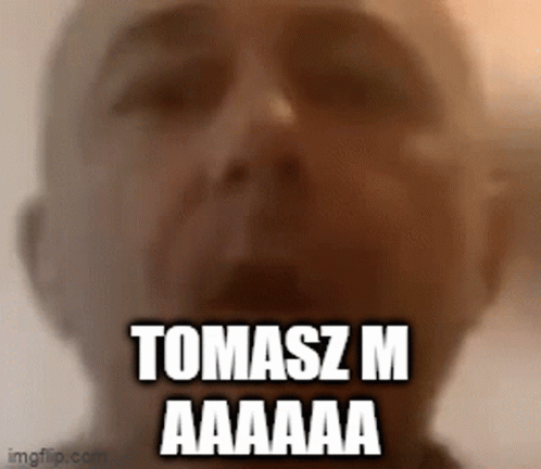 A Close Up Of A Man 'S Face With The Words Tomasz M Aaaaa GIF