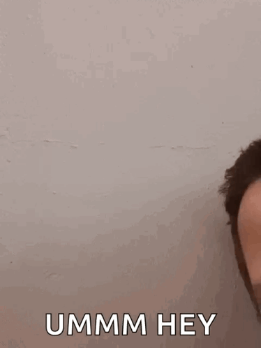 A Close Up Of A Man 'S Face With The Words `` Ummm Hey '' Written On The Bottom . GIF