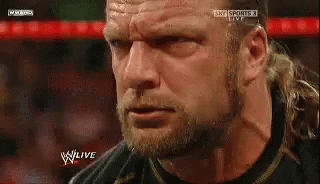 A Close Up Of A Man 'S Face With The Words W Live On The Bottom Right GIF