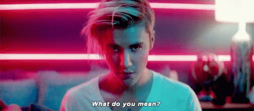 A Close Up Of A Man 'S Face With The Words `` What Do You Mean ? '' GIF