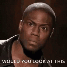 A Close Up Of A Man 'S Face With The Words `` Would You Look At This '' . GIF