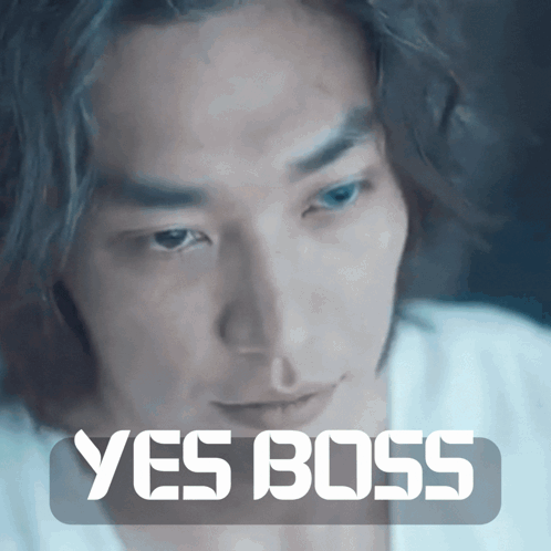 A Close Up Of A Man 'S Face With The Words " Yes Boss " Above Him GIF