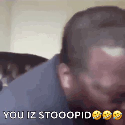A Close Up Of A Man 'S Face With The Words " You Iz Stooopid " On The Bottom GIF