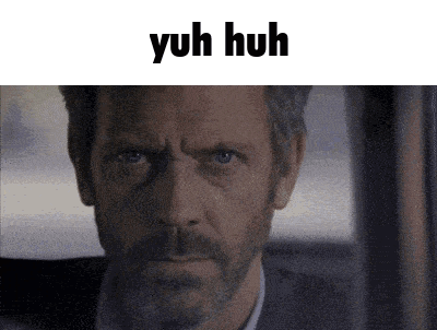 A Close Up Of A Man 'S Face With The Words Yuh Huh Written Above Him GIF