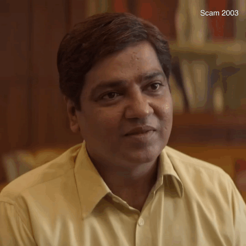 A Close Up Of A Man 'S Face With The Year 2003 On The Bottom Left GIF