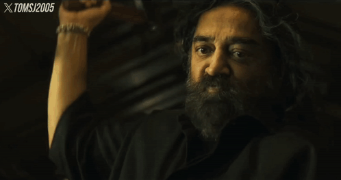 A Close Up Of A Man 'S Face With The Year 2005 On The Bottom Right Corner GIF