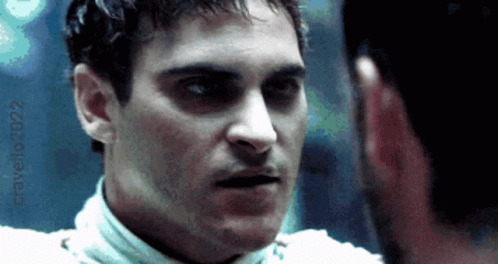 A Close Up Of A Man 'S Face With The Year 2022 Visible GIF