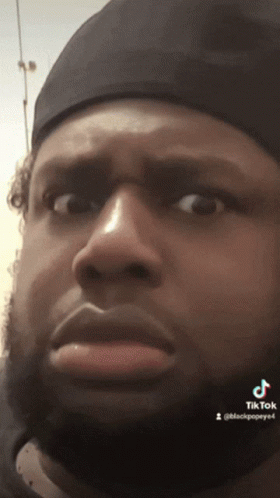 Close Up Of Man's Face With TikTok Text GIF