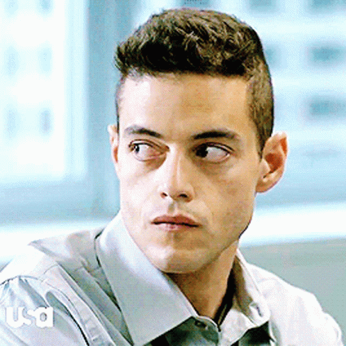 A Close Up Of A Man 'S Face With Usa Written On The Sleeve Of His Shirt GIF
