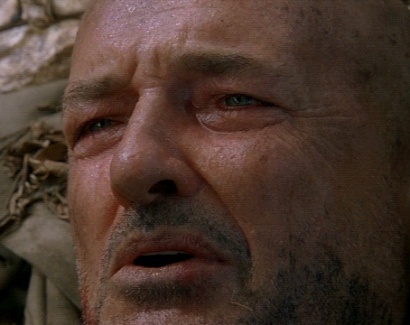 A Close Up Of A Man 'S Face With Water On His Face GIF