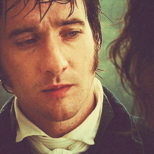 A Close Up Of A Man 'S Face With Wet Hair GIF