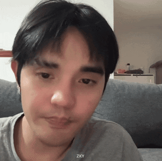 A Close Up Of A Man 'S Face With Zky Written On The Bottom GIF