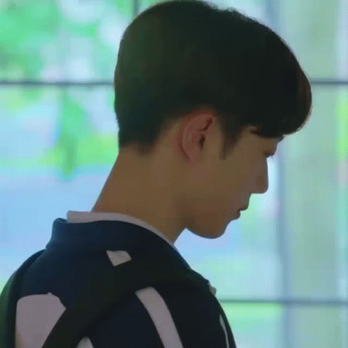 A Close Up Of A Man 'S Head With A Backpack . GIF