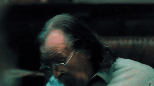 A Close Up Of A Man 'S Head With Glasses And A Beard GIF