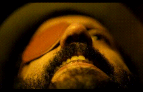 A Close Up Of A Man 'S Mouth With A Beard GIF