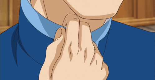 a close up of a man 's neck with a blue shirt