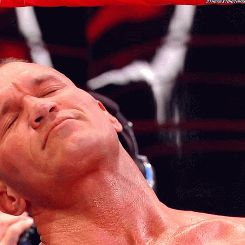 A Close Up Of A Man 'S Neck With The Hashtag #Thenextbig Thing Visible GIF