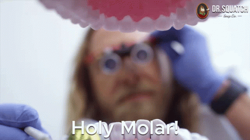 A Close Up Of A Man 'S Teeth With The Words Holy Molar Written On The Bottom GIF