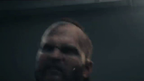 a close up of a man screaming with his mouth open in a video game .