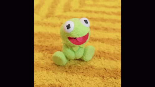 A Close Up Of A Man Singing Into A Microphone . GIF