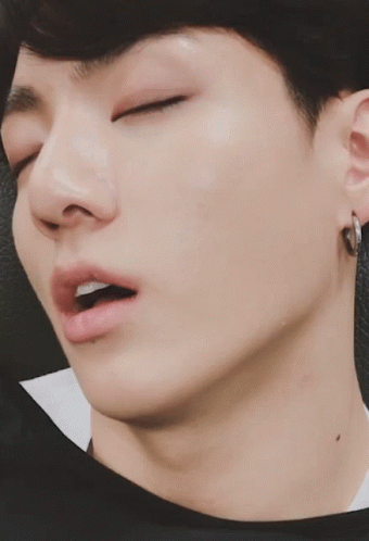 A Close Up Of A Man Sleeping With His Eyes Closed GIF