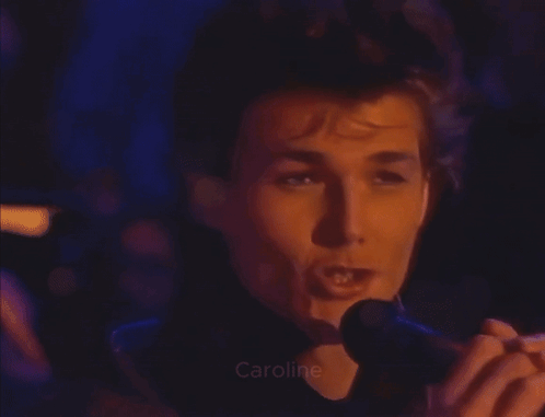 A Close Up Of A Man Taking A Picture With The Name Caroline Visible GIF