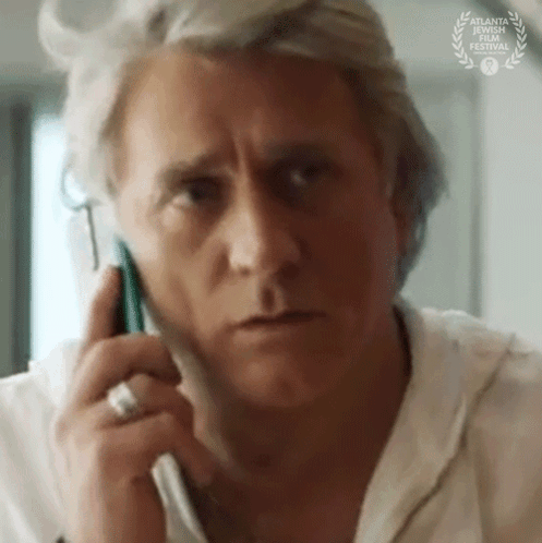 Close Up Of Man Talking On Cell Phone GIF