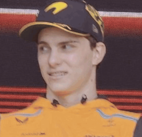 A Close Up Of A Man Wearing A Baseball Cap And A Yellow Shirt . GIF