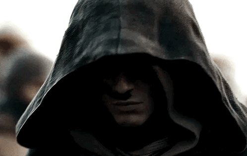 A Close Up Of A Man Wearing A Black Hood GIF