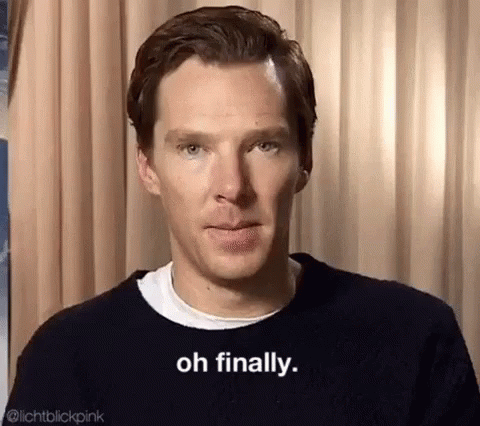 A Close Up Of A Man Wearing A Black Sweater And A White Shirt . GIF